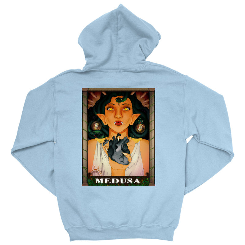 Medusa’s Black Heart Hoodie featuring an illustration of Medusa with a black heart design on a light blue hoodie.