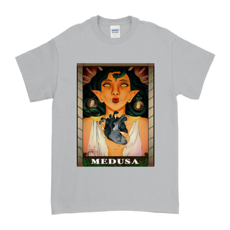 Medusa’s Black Heart Tee featuring a fierce illustration of Medusa holding a black heart on a gray t-shirt.