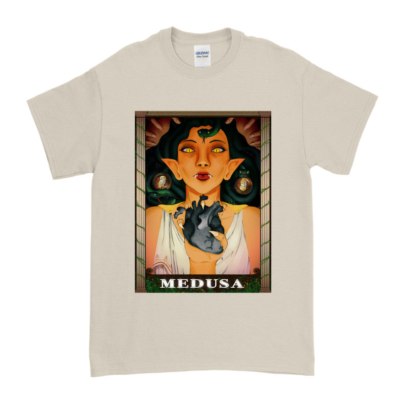 Medusa’s Black Heart Tee featuring an illustrated character holding a black heart, showcasing the design with the word 'Medusa'.